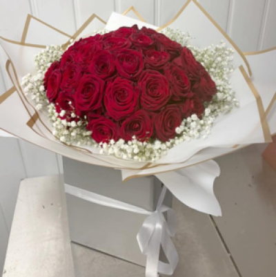 Rose perfection - 50 x red luxury Naomi roses edged with gypsophlia displayed in a box with luxury gold trimmed wrapping