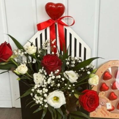 Love Letter & Chocolates - A love letter filled with red roses, lisanthus, gypsophila & foliage along a box of chocolates.