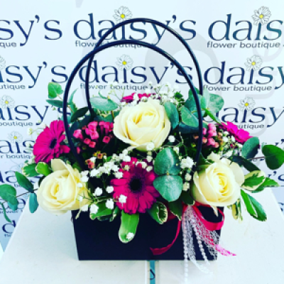 Flower handbag  - Gorgeous selection of vibrant flowers arranged in oasis inside a watertight handbag 