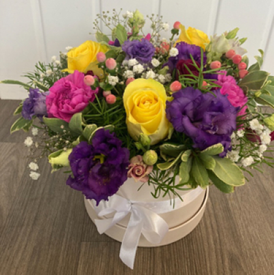 Veronica - Vibrant colour themed hatbox with flowers arranged in oasis 