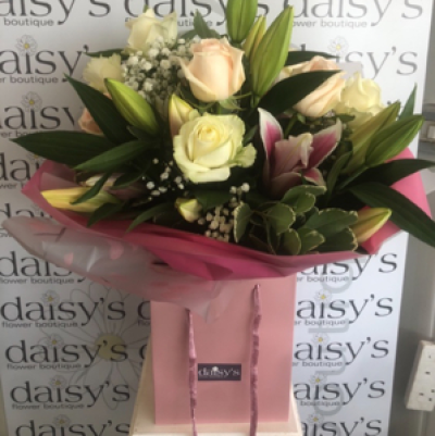 Tia  - Oriental pink lillies, white luxury roses , foliage handtied and aqua packed 