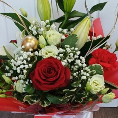 Christmas Special - A flower box bursting with beautiful blooms arranged in oasis. A selection of christmas themed flowers & decorations in red, whites & golds.