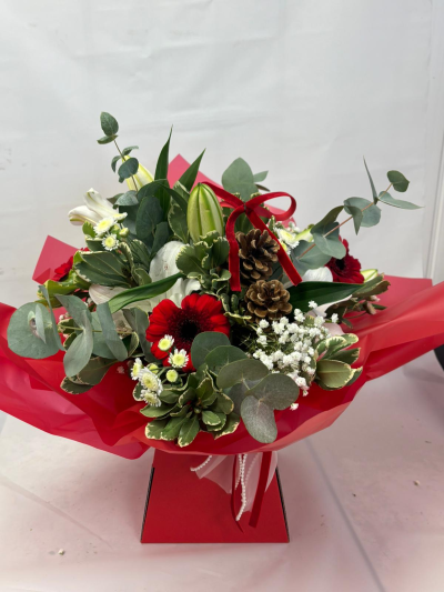 Christmas Special - A flower box bursting with beautiful blooms arranged in oasis. A selection of christmas themed flowers & decorations in red, whites & golds.