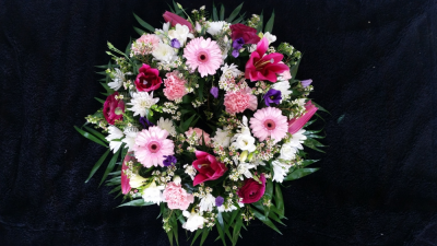 Wreath - Pink & Purple - A traditional round wreath with seasonal flowers in pinks, purples & whites
