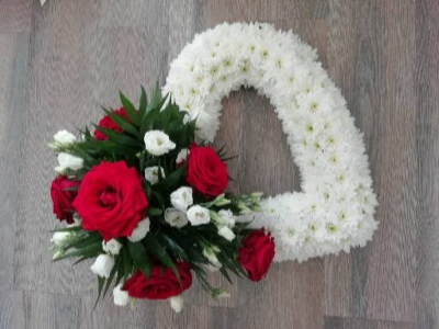 Based Open Heart - Red & White - A open heart tribute massed in white double chrysanthemums with a side cluster of Red Roses & a mixture of white flowers.