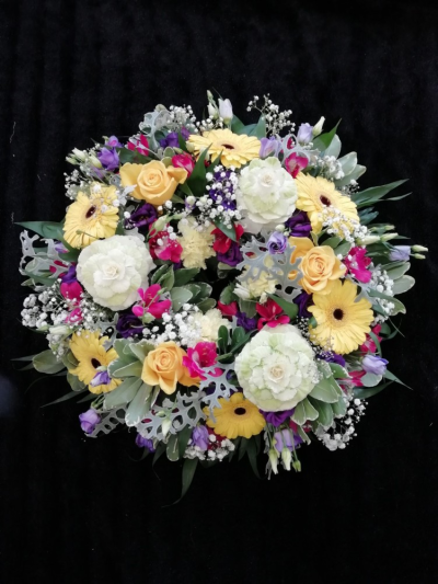 Wreath - Yellow, Pink & Purple - A Wreath tribute in Cerise Pink, Yellow & Purple theme filled with seasonal flowers & foliages