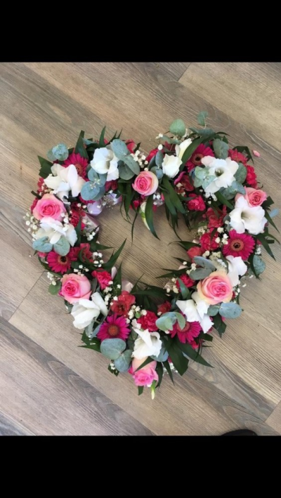 Loose Open Heart - Pink & White - A beautiful loose open heart in different shades of pinks & whites. Includes Roses, gerberas and a range of seasonal flowers & foliages