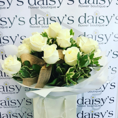 White Roses - A gorgeous handtied with White Roses with foliages. This arrangement is presented lovely in a gift bag