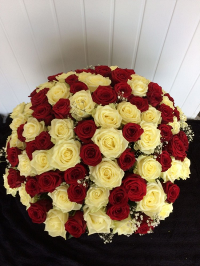 100 Red & White Roses - A stunning 100 Luxury red & white Roses with Gypsophila. This is definately one to remember. Presented in a very stylish gift box finished off with an organza bow. This is a romantic gesture at its finest.