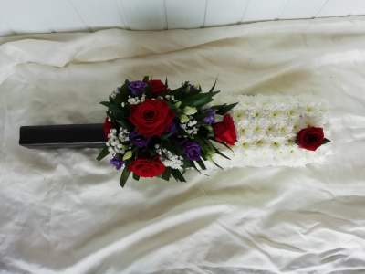 Cricket Bat - A Cricket bat floral tribute created with your own choice of handle colour/pattern plus a cluster of season flowers.

Please add your choice of colour and design to the comments section on your order
