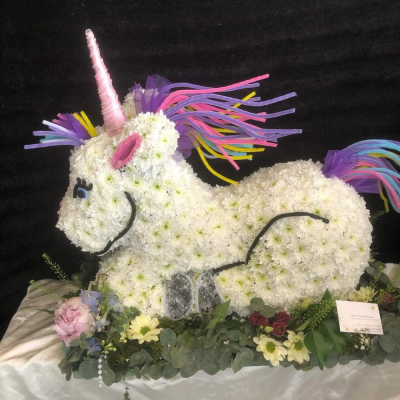Unicorn - This beautiful Unicorn Funeral Tribute is made by Daisys from start to finish. It is carefully created to ensure a high quailty tribute is provided.