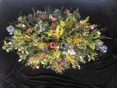 Casket Spray - Wild Garden - A casket oasis spray in a wild garden theme. A stunning tribute for a lady or gentleman.
