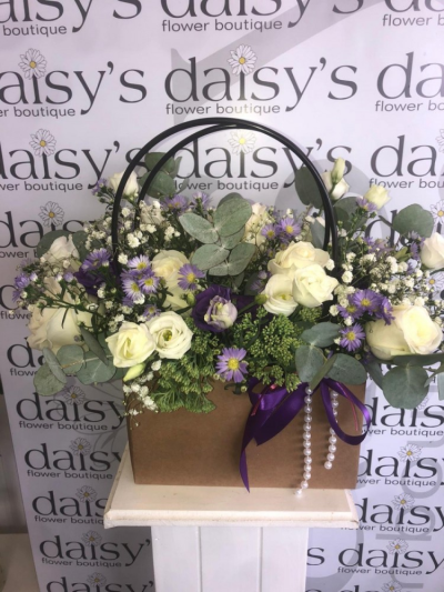 Leona - A beautiful handbag design bursting with seasonal flowers & foliages in purple & white.

 

Colour of the bag may change