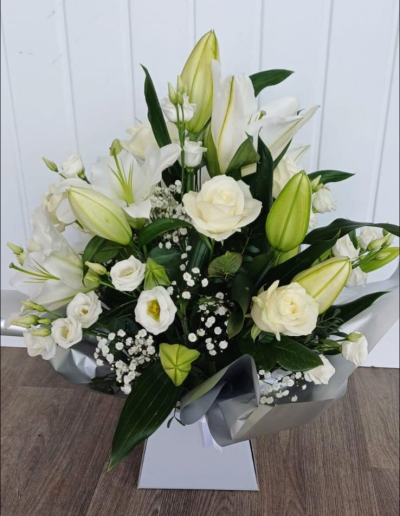 White Lily & Rose - A stunning collection of roses and lilies hand-tied and delivered by a local florist.