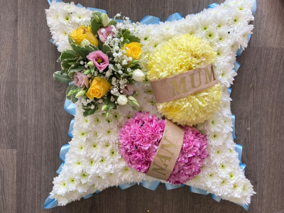 Knitting Wool - A beautiful cushion with a ribbon edge, white chrysanthemums based, cluster of flowers & two balls of knitting wool made out of flowers with sashes added.

The colour of the ribbon, wool, cluster and names on the sash can all be changed to suit your choice of colour theme. Please add your colour & name requests in the comments section when placing your order.