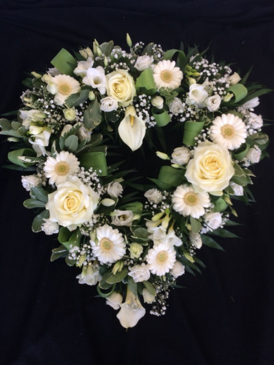 Loose Open Heart - White & Green - Beautiful loose open heart in white and greens. Contents include white roses, white germinis, white calla lillies and a mixture of other flowers and foliages