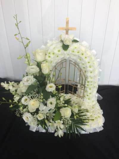 Gates Of Heaven - White & Green - Gates of heaven tributed massed in white double chrsyanthemums with a white & green cluster. Finished off with a white ribbon edge