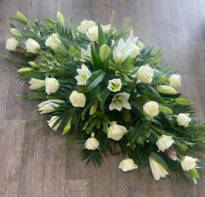 Casket spray - Subtle and classic selection of white roses and white lillies