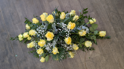 Casket Spray - Yellow & White - A casket spray filled with only yellow Roses, white Lisanthus, Gypsophila & foliages