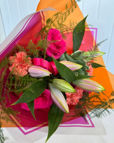 Bouquet - Cerise & Orange - A mixture of seasonal flowers in Cerise & orange colour theme; wrapped out of water