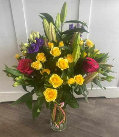 Vase - Vibrant - A vibrant array of flowers & foliages arranged in a glass vase