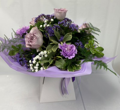 Willow - A beautiful selection of season flowers in purples with a touch of white