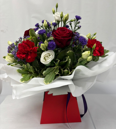 Paris - A beautiful selection of flowers in reds, purples and whites to include our gorgeous red Naomi roses