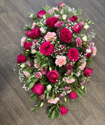 Casket Spray - Pink & White - A casket spray filled with different shades of pinks and a touch of white in a range of seasonal flowers & foliages