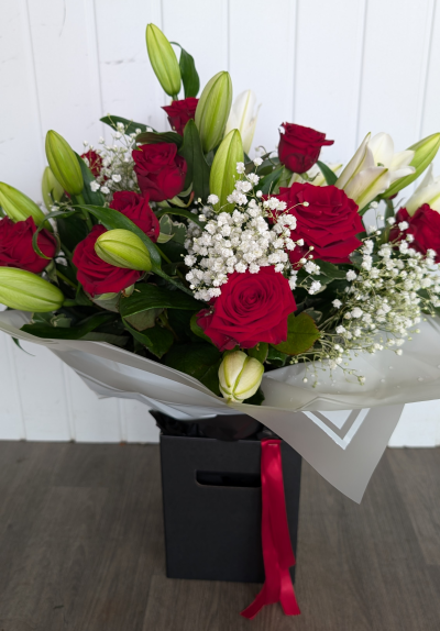 Flowerbox - Roses & Lillies - A hand tied arrangement bursting with white lillies, red roses, gypsophila & foliages presented in a gift box