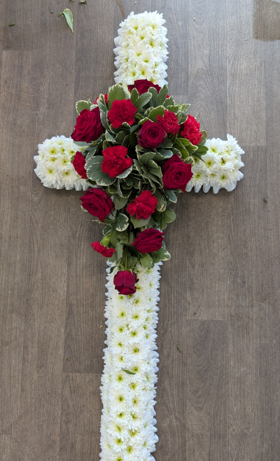 Casket Cross - Red & White - A stunning cross to be placed on top of the basket. The cross is based in white chrysanthemums, white ribbon edge and a red rose & carnation cluster
