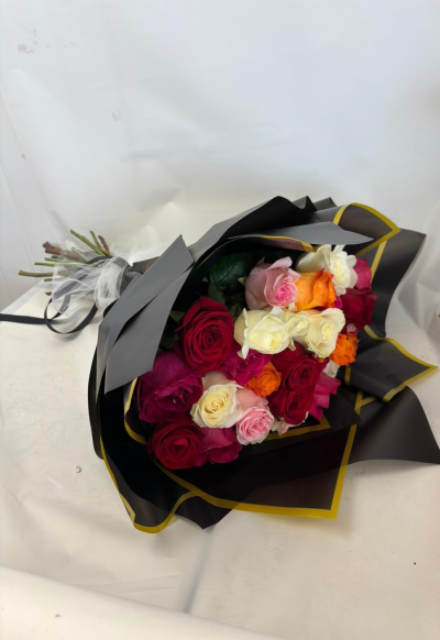 Adeline - A mixed of our gorgeous coloured roses; wrapped beautifully in our luxury cellophane & finished off with a satin bow