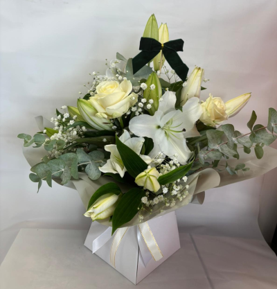 Winter Wonderland - A beautiful white Flowerbox filled with seasonal blooms with a magical touch of Christmas