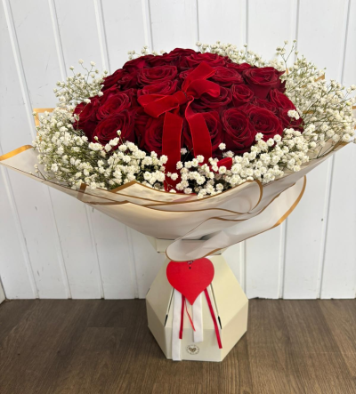 36 Red Roses - A stunning arrangement of 36 luxury red Naomi roses and edged with white gypsophila in a floral box