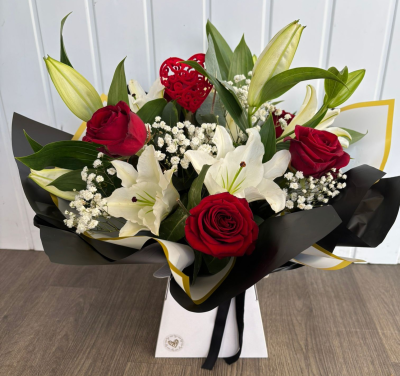 Lily & Rose - An arrangement filled with lillies, roses, gypsophila & greenery