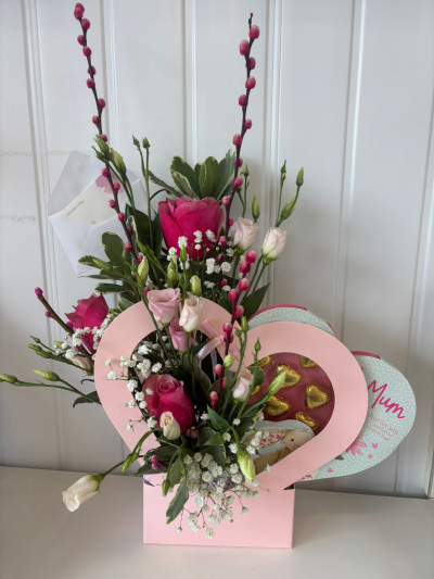 Sweetheart - A beautiful flower arrangement in a heart box with chocolates